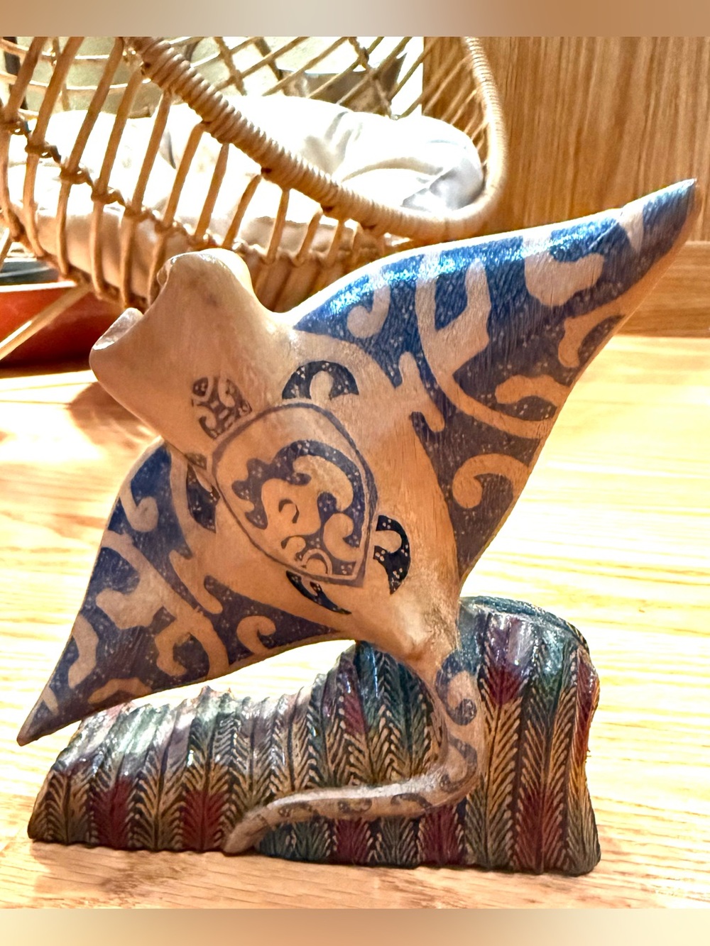 One of a kind hand-carved wooden manta ray sculpture mounted on a textured base